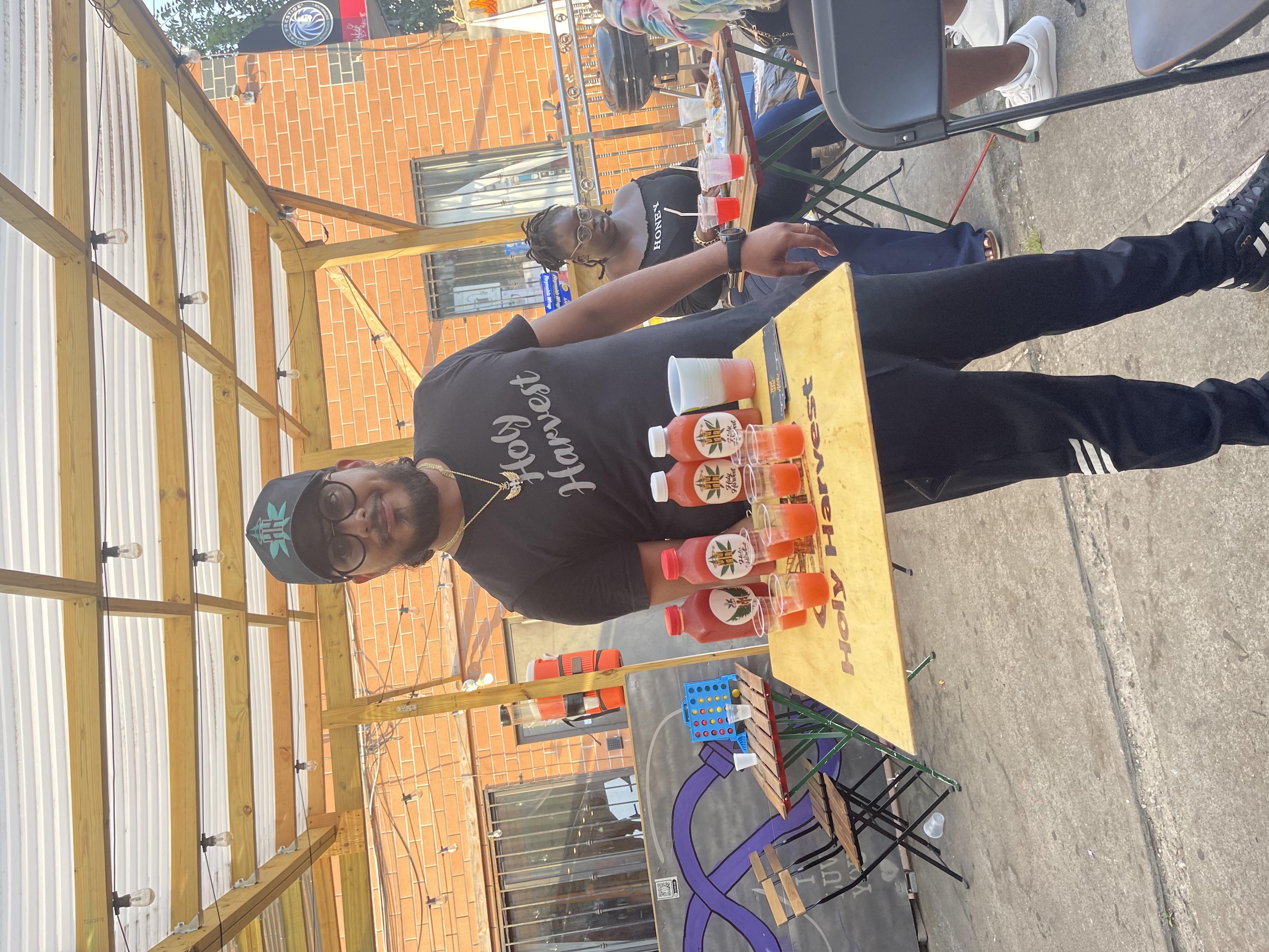 Founder and customer celebrating with a lemonade bottle